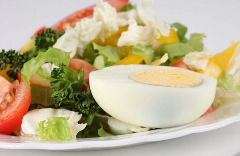 Fresh vegetable salad with boiled egg on the Maggi diet menu